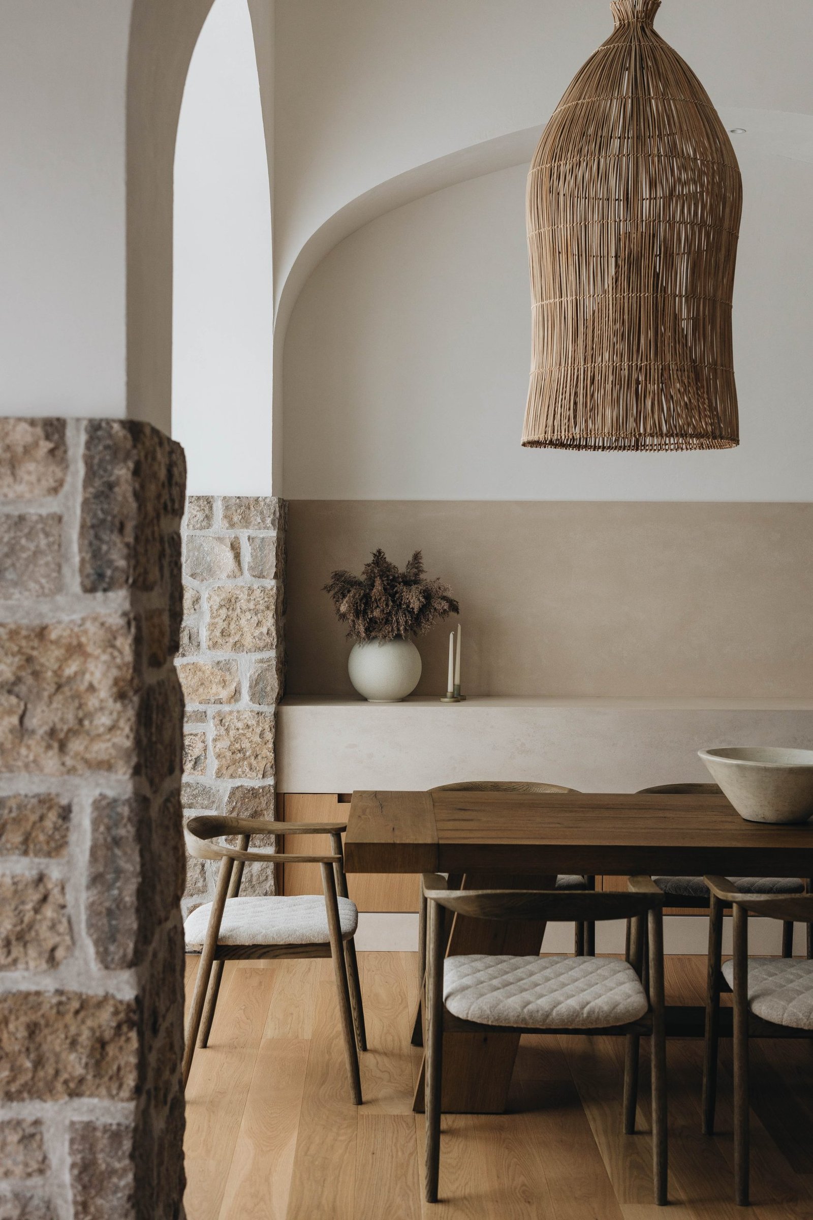 Dining area with plaster walls and arches