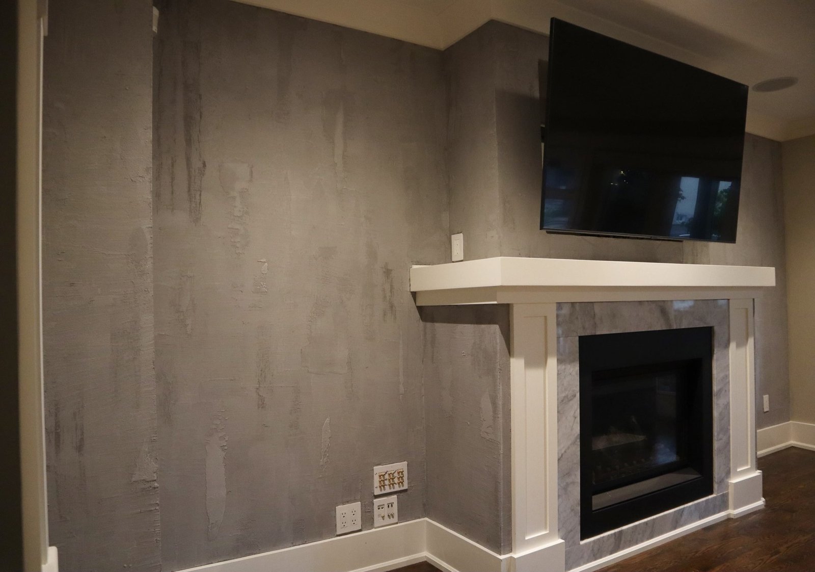 Microcement feature wall with fireplace