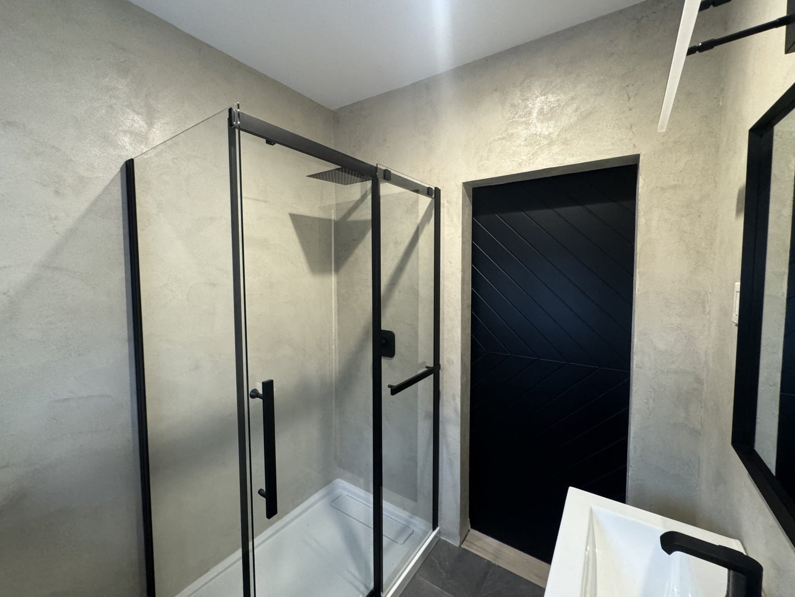 Microcement bathroom with glass shower